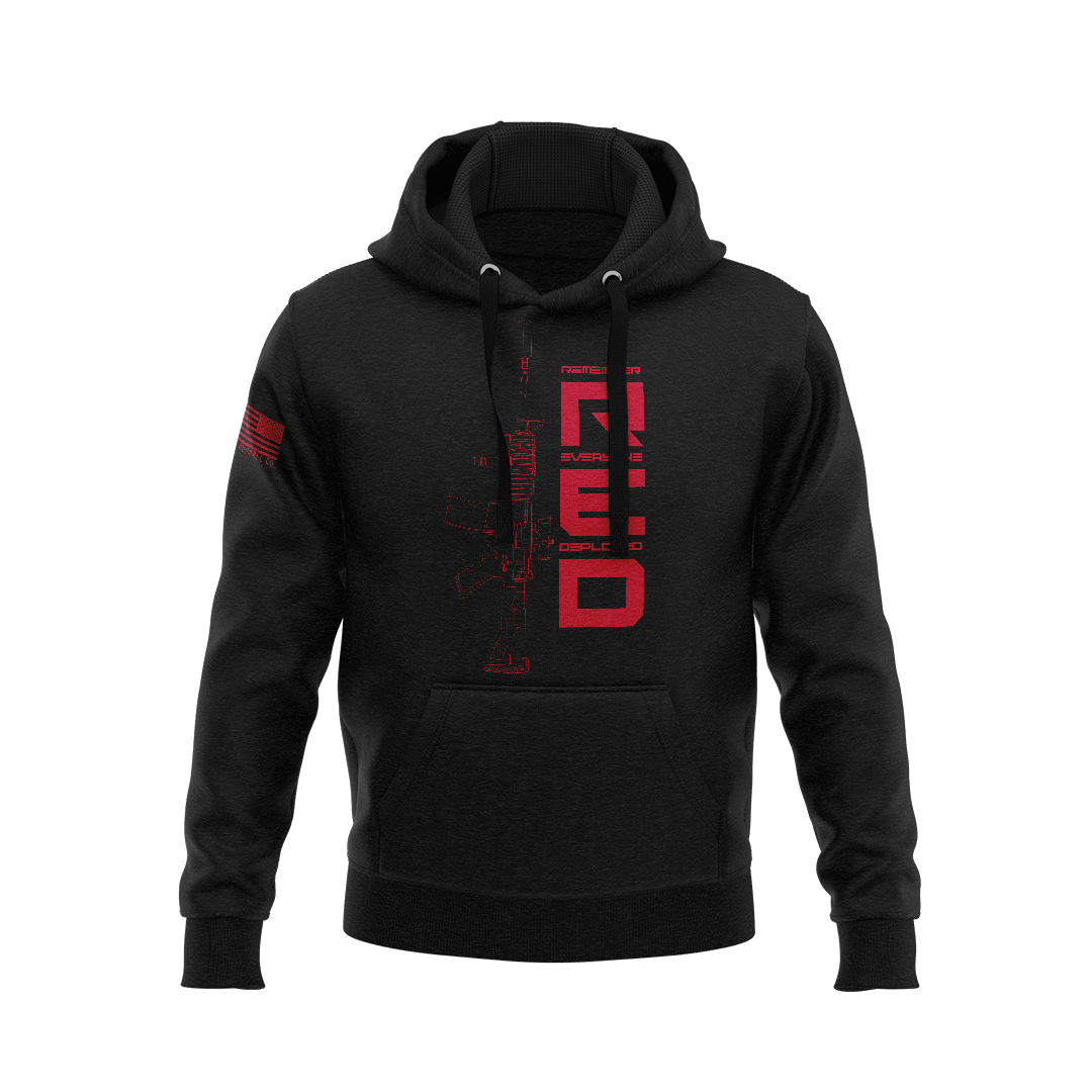 Black hoodie showcasing vertical red "RED" text, rifle outline chest graphic, and right sleeve American flag patch.