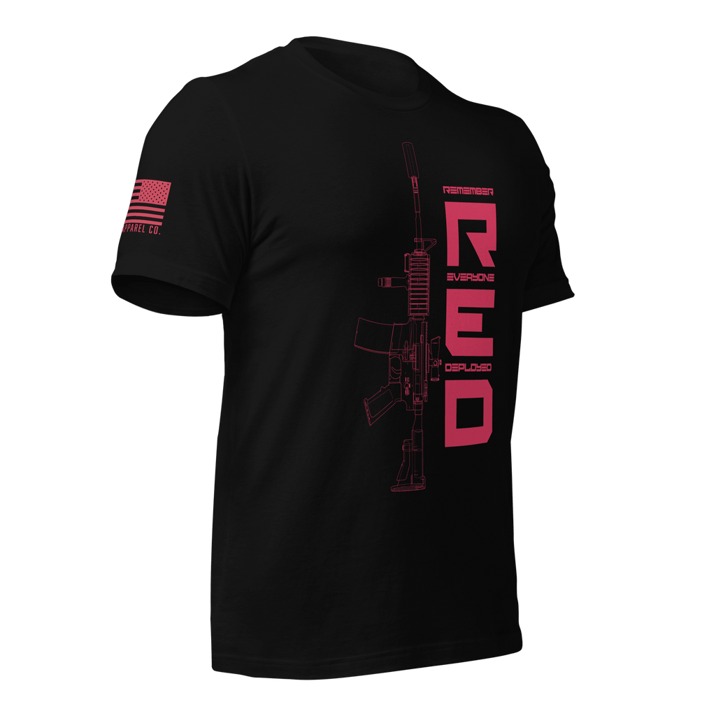 Black t-shirt in a three-quarter view, featuring a red "RED" graphic, rifle art, and American flag on the sleeve.