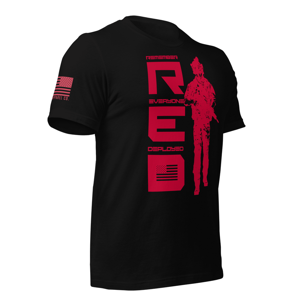 Black t-shirt, angled left, featuring red R.E.D. text, soldier silhouette, and red American flag on the sleeve.
