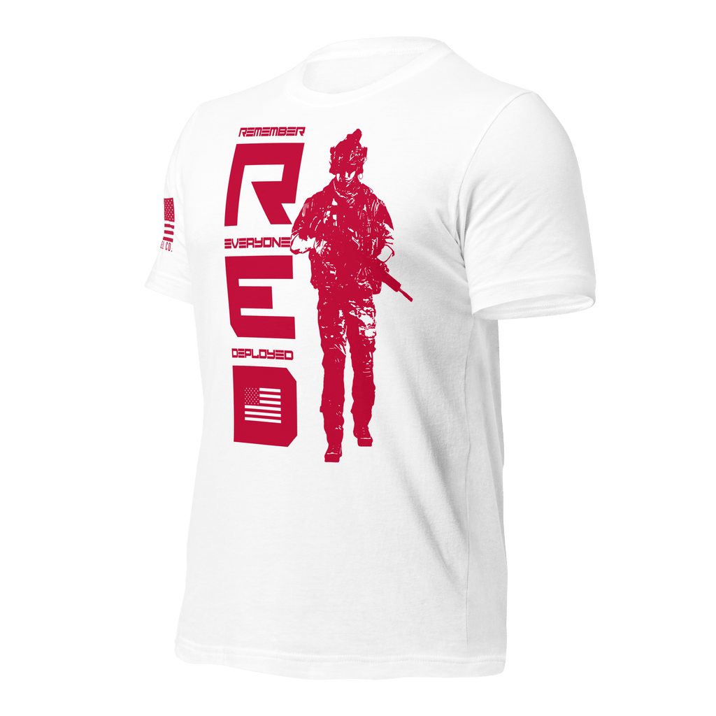 White t-shirt, angled right, featuring red vertical R.E.D. text, soldier silhouette, and red American flag on the sleeve.