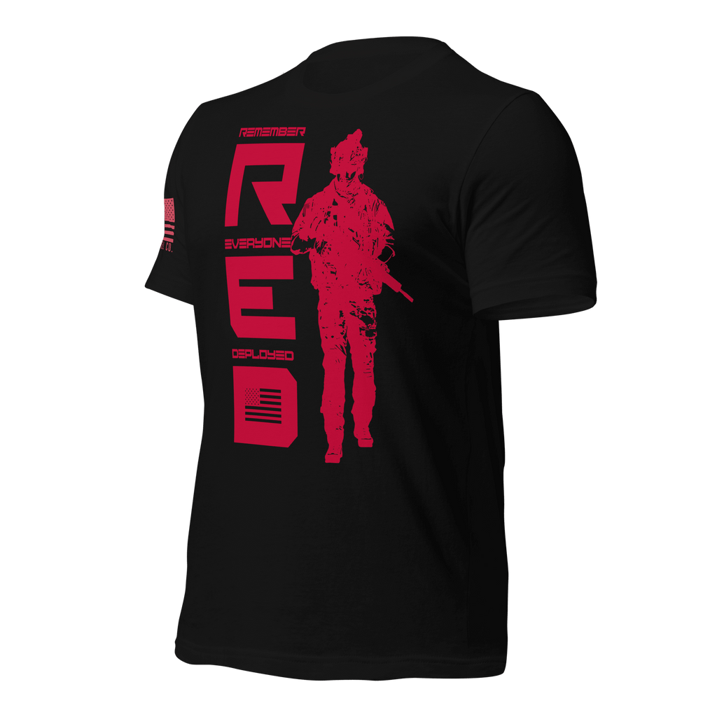 Black t-shirt, angled right, featuring red R.E.D. text, soldier silhouette, and red American flag on the sleeve.