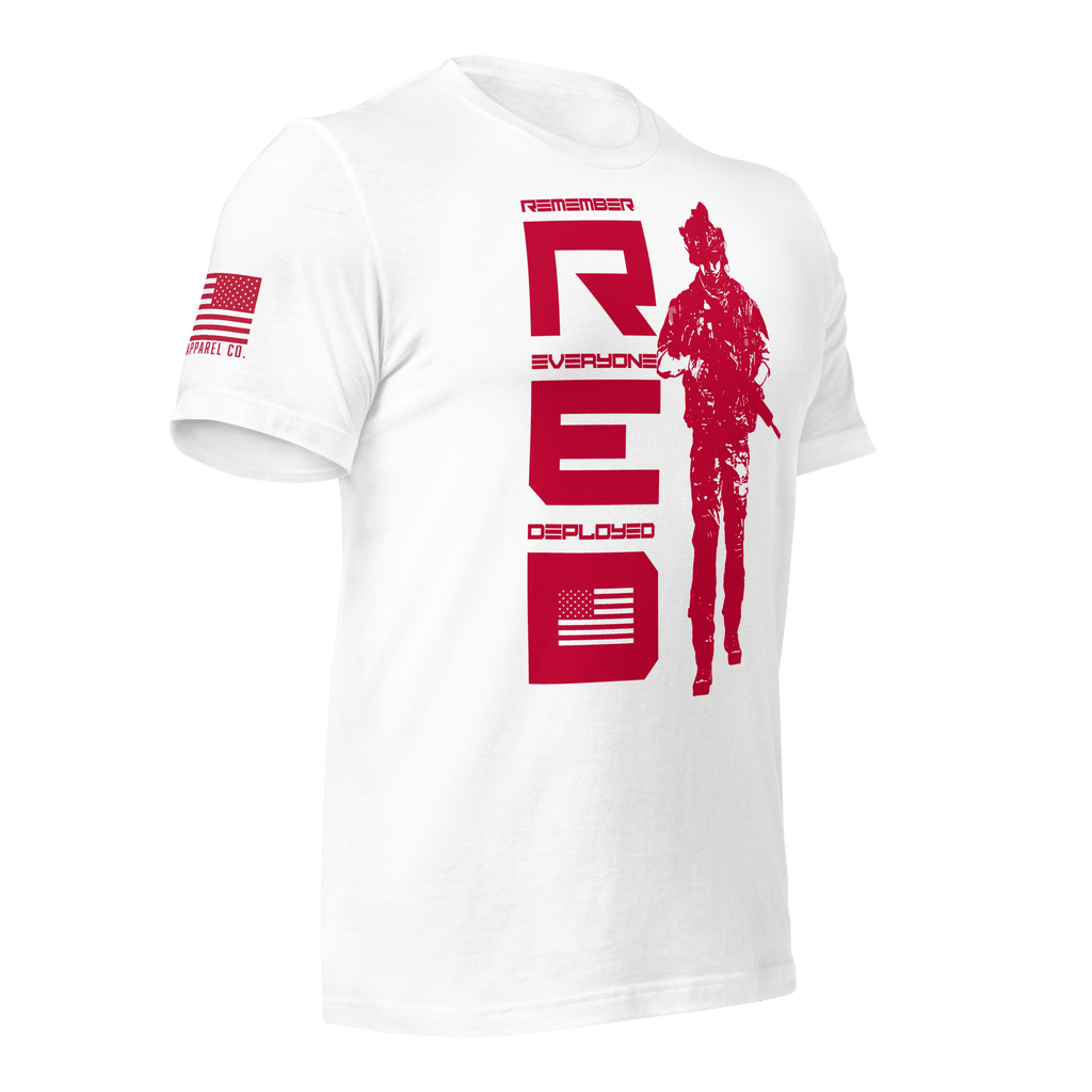White t-shirt, angled left, featuring red vertical R.E.D. text, soldier silhouette, and red American flag on the sleeve.