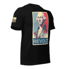 Black t-shirt angled left featuring a George Washington "REVOLT" graphic and an American flag on the sleeve.