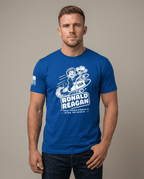Man in studio wearing blue t-shirt with cartoon Ronald Reagan on a missile graphic and "Peace Through Strength".