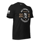 Black t-shirt, angled left, featuring a circular boots chest graphic, August XXVI text, and an American flag.