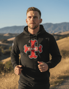 Man jogging, wearing a black hoodie with a red cross, "DEUS VULT" text, and an American flag on the right sleeve.