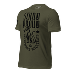Military green shirt angled right, "STAND PROUD" lion graphic, "NEVER HERDED" text, DIA logo, and American flag on sleeve.