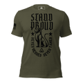 Military green shirt, "STAND PROUD" lion graphic, "NEVER HERDED" text, DIA logo, and American flag on sleeve.