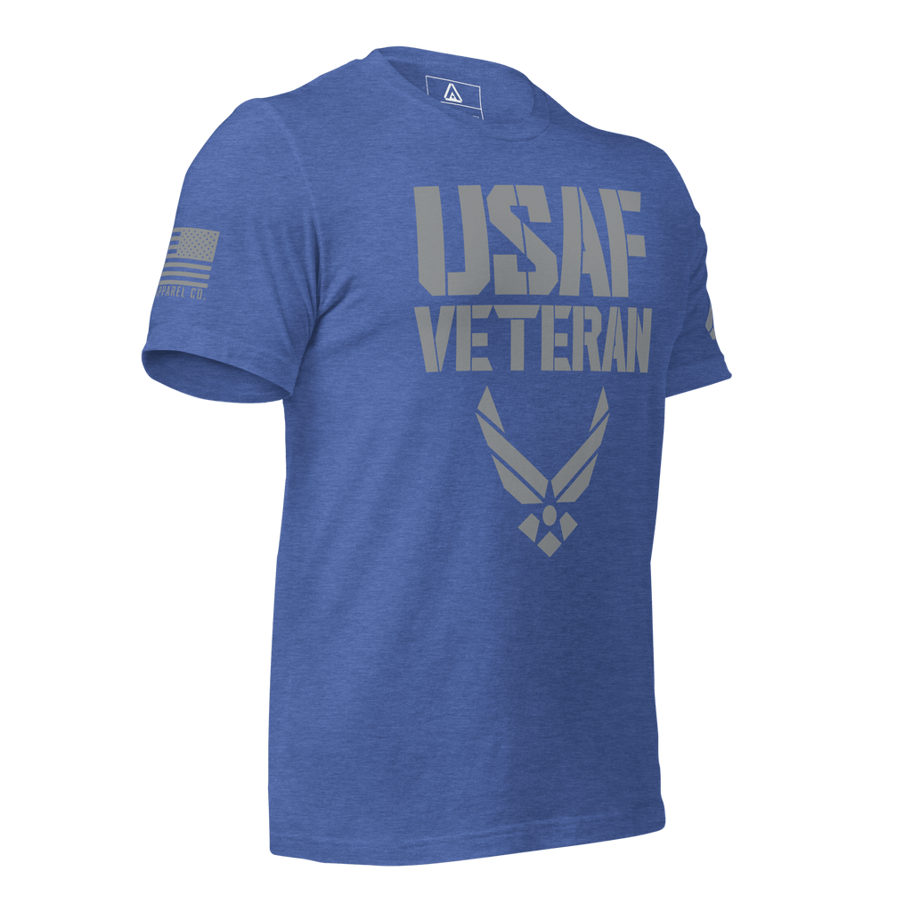 Heather true royal blue t-shirt, three-quarter view angled left, featuring a grey "USAF VETERAN" graphic and an American flag