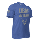 Heather true royal blue t-shirt, three-quarter view angled left, featuring a grey "USAF VETERAN" graphic and an American flag