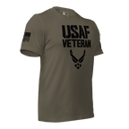 Army green t-shirt, three-quarter view angled left, featuring a black "USAF VETERAN" graphic and an American flag graphic.