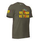 Army green t-shirt, three-quarter view angled left, featuring a yellow American flag on the sleeve.