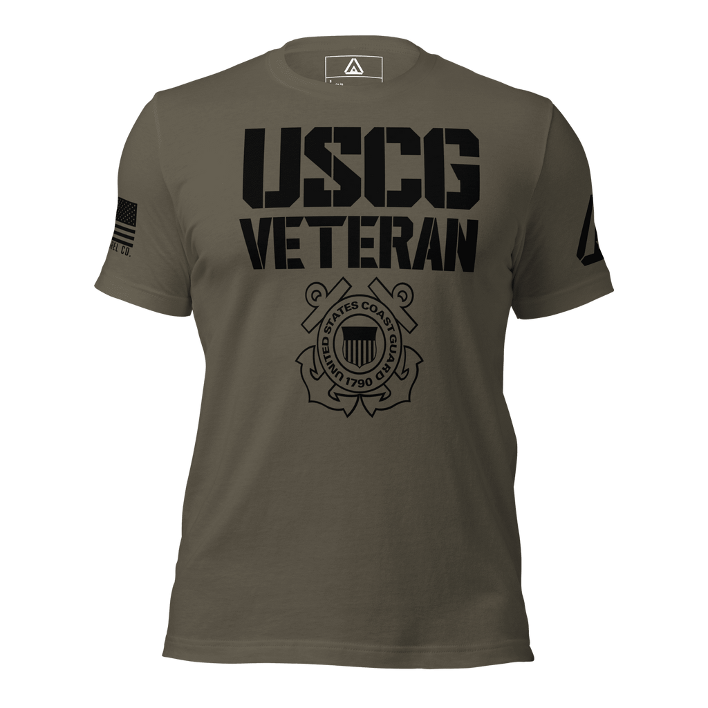 Dark army green t-shirt, front view, with black "USCG VETERAN" text, military emblem, and an American flag on the sleeve.