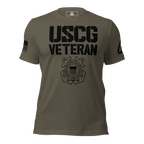 Dark army green t-shirt, front view, with black "USCG VETERAN" text, military emblem, and an American flag on the sleeve.