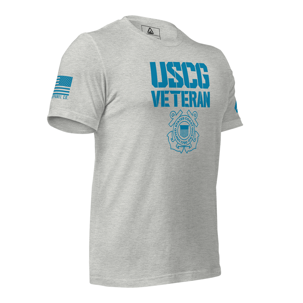 Athletic heather t-shirt, angled left, featuring USCG Veteran text, Coast Guard emblem, and blue American flag.