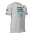 Athletic heather t-shirt, angled left, featuring USCG Veteran text, Coast Guard emblem, and blue American flag.