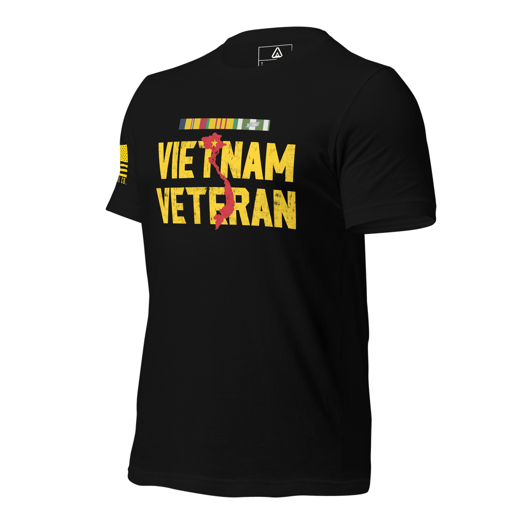 Black t-shirt, three-quarter view angled right, with "VIETNAM VETERAN" text, a red map of Vietnam, and USMC ribbons.