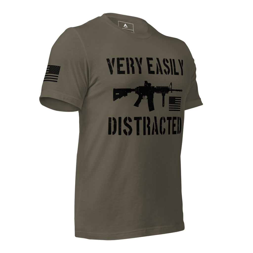 Army green shirt angled left featuring a black "VERY EASILY DISTRACTED" rifle graphic and a black American flag.