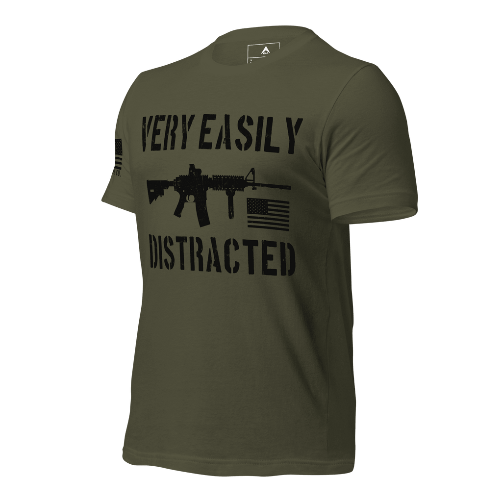 Army green shirt angled right featuring a black "VERY EASILY DISTRACTED" rifle graphic and a black American flag.