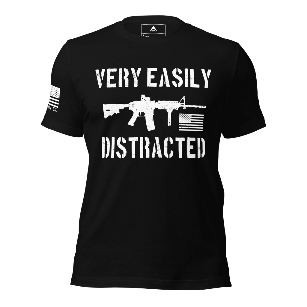Front-facing black shirt featuring a white "VERY EASILY DISTRACTED" rifle graphic and a white sleeve flag.