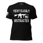 Front-facing black shirt featuring a white "VERY EASILY DISTRACTED" rifle graphic and a white sleeve flag.