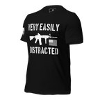 Black shirt angled right featuring a white "VERY EASILY DISTRACTED" rifle graphic and a white sleeve flag.