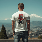 Man by snowy mountains in a white t-shirt with a samurai and red sun back graphic and black sleeve flag.