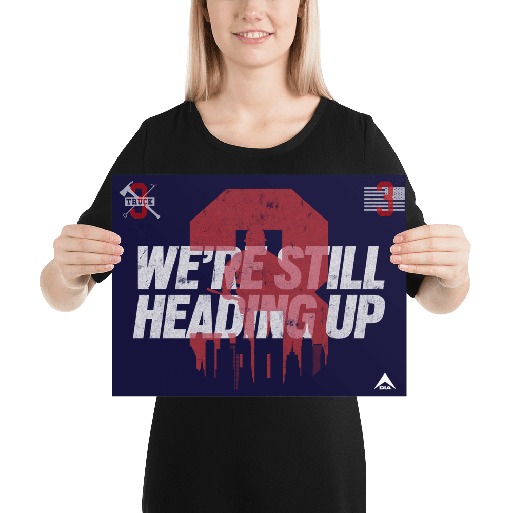 A smiling woman in black holds a large navy "3 Truck" poster with white text and red graphics.